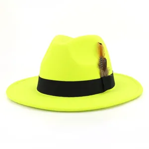 Neon yellow wool felt fedora hat with black band and feather detail, stylish jazz cap.