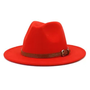 Red fedora hat detail view, classic wool felt wide brim hat with brown leather strap for winter.