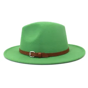 Close-up detail of the green wool fedora hat with brown belt and silver buckle decoration.