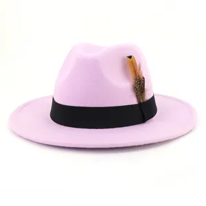 Pink wool fedora hat with black band and feather detail, classic fashion accessory.