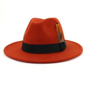 Orange woolen fedora hat with black ribbon and stylish feather detail, elegant autumn winter wear.