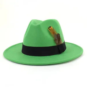 Green felt fedoras hat with black ribbon and feather detail for daily wear and fashion styling.