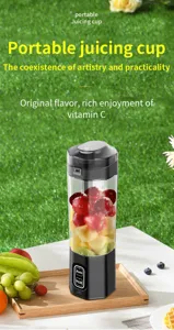 Detail view of portable electric juicing cup with fresh fruit inside for daily health drinks.