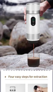 Portable electric coffee maker detail showing extraction process outdoors with digital screen.