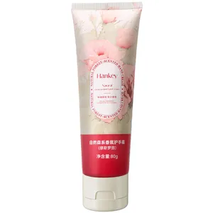 Close-up view of the botanical scented hand cream tube with floral design and 80g portable size.