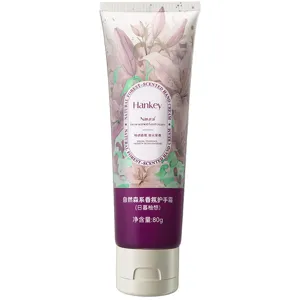 Close-up detail of Hankey botanical scented hand cream tube, elegant lily flower illustration.