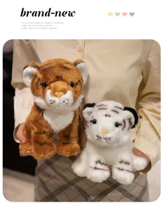Detailed shot of cute simulation tiger plush toys, brown and white dolls for kids play.