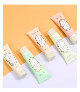 Detailed shot of assorted fruit and floral scent hand cream tubes, 80g moisturizing formulas.