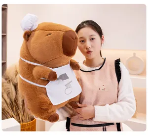Giant capybara plush toy detailed view, featuring cute chef hat and noodle apron design.
