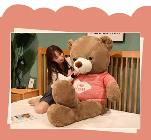 Large brown teddy bear plush toy with pink heart sweater, soft stuffed doll for birthday gift.