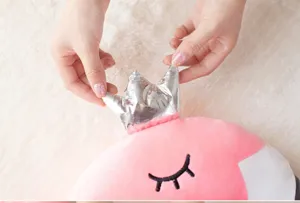 Pink flamingo plush pillow with silver crown detail, soft stuffed animal doll for cozy home decor.