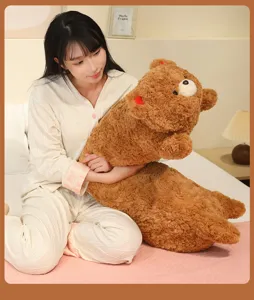 Detailed close-up view of the cute brown plush hugging bear pillow for bedroom comfort.