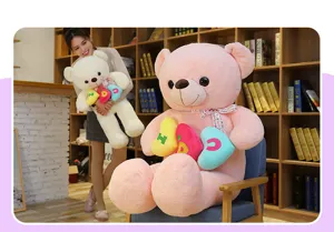 Grande orsetto di peluche con cuscino a cuore, morbido animale regalo perfetto per San Valentino.