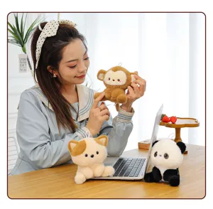 Detailed desk scene showcasing cute plush animal toys including monkey, cat, and panda.