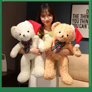 Detailed view of the cute Christmas teddy bear plush toy with festival scarf and hat.