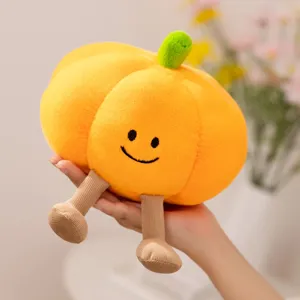 Adorable peluche citrouille d'Halloween avec jambes pendantes, poupée douce déco de fête.