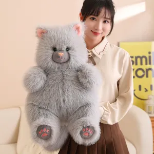 Fluffy gray cat plush toy held by model, soft stuffed animal doll for kids gift.