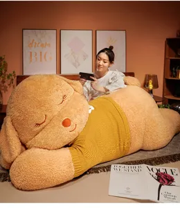 Giant sleeping dog plush toy with yellow sweater, cute stuffed animal pillow for kids and girls detail view