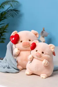 Detailed view of cute pink plush pig doll toy holding red heart balloon, soft texture.