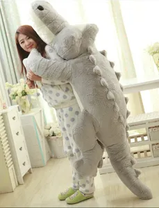 Giant stuffed crocodile plush toy pillow, soft oversized animal doll for kids and home decor.