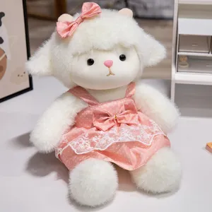 Close-up detail of cute lamb plush toy in pink polka dot dress, soft comforting doll for kids.