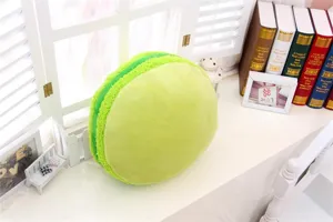 Grünes Makaron Plüschkissen Detail, weiches Kissen für Heimdekoration oder Büro Nickerchen.