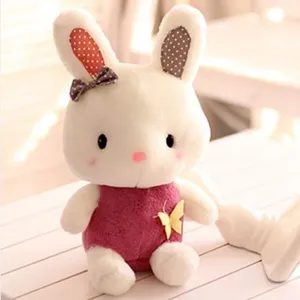 Cute plush rabbit toy doll, soft stuffed cartoon animal with cute bow and romper gift.