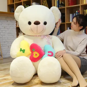 Grande orsacchiotto di peluche bianco con cuscini a cuore colorati regalo di San Valentino