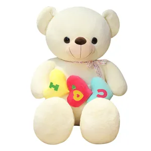 Grande orsacchiotto di peluche con cuscini a cuore, regalo romantico e dolce per festa.