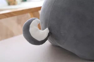 Cute grey husky plush toy tail detail close up, soft fluffy material for kids gift.