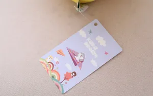 Detailed close up of cute husky plush toy hanging tag with charming cartoon design.