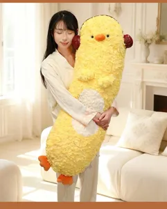 Cozy plush body pillow detail showing soft yellow fabric and cute design for hugging sleep.