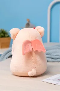 Cute angel pig plush toy, soft stuffed animal doll with wings for kids birthday gift. Detail.