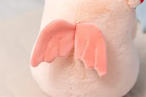 Close up detail view of cute pink angel pig plush toy featuring soft fabric and lovely wings.
