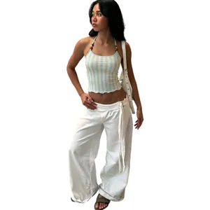 Close-up detail of the stylish halter striped camisole with beads and backless fit design.