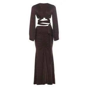 Dark brown long sleeve cut-out crop top and ruched long skirt detail view, elegant evening style.