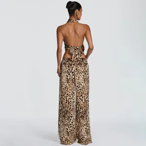 Back view detail of the leopard print halter neck backless crop top and wide leg pants set.