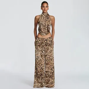 Leopard print halter top and low-waist trousers detail, stylish summer two-piece outfit.