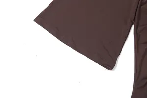 Detailed view of the solid brown flared sleeve, showing fine stitching and smooth fabric.