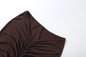 Close-up detail of dark brown ruched women skirt fabric texture design fashion apparel