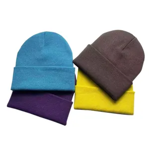 Close-up detail shot of colorful knit beanies in blue, purple, brown, and yellow.