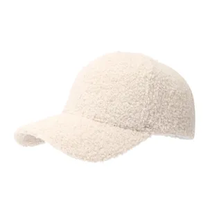 Detailed shot of beige fluffy lamb wool baseball cap, soft sherpa texture, winter warm outdoor hat.