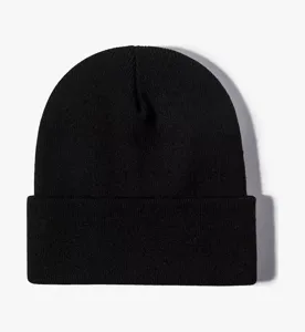 Solid color knit beanie detail view, showing cuffed winter warm hat structure clearly.