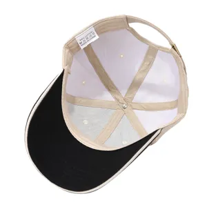 Interior detail of color-block baseball cap, breathable mesh lining, adjustable strap.