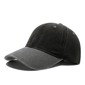 Detailed view of the vintage washed denim baseball cap, showing fine stitching and texture.