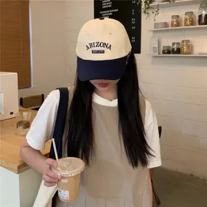 Close-up of a stylish Korean colorblock baseball cap featuring cool Arizona text embroidery.