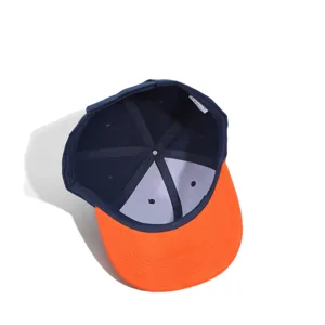 Detail view of the six-panel color-blocked baseball cap interior structure and brim.