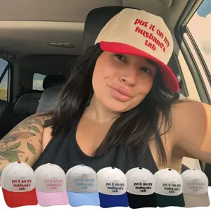 Cotton trucker hat with custom embroidered text, stylish colorblock design for casual wear.