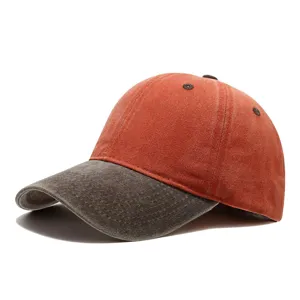 Vintage washed two-tone baseball cap, distressed orange crown and dark grey curved brim.