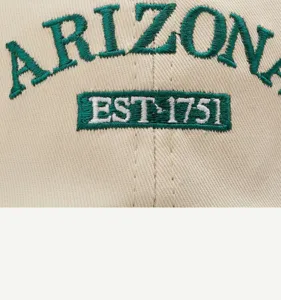 Cotton baseball cap detail featuring green Arizona embroidery and EST 1751 logo badge.